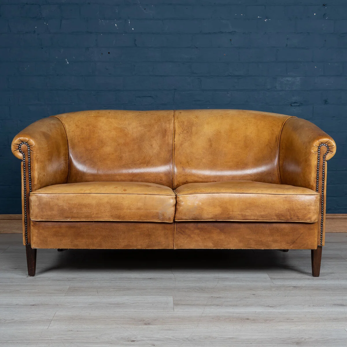 A two seater tan leather sofa, Holland, late 20th century