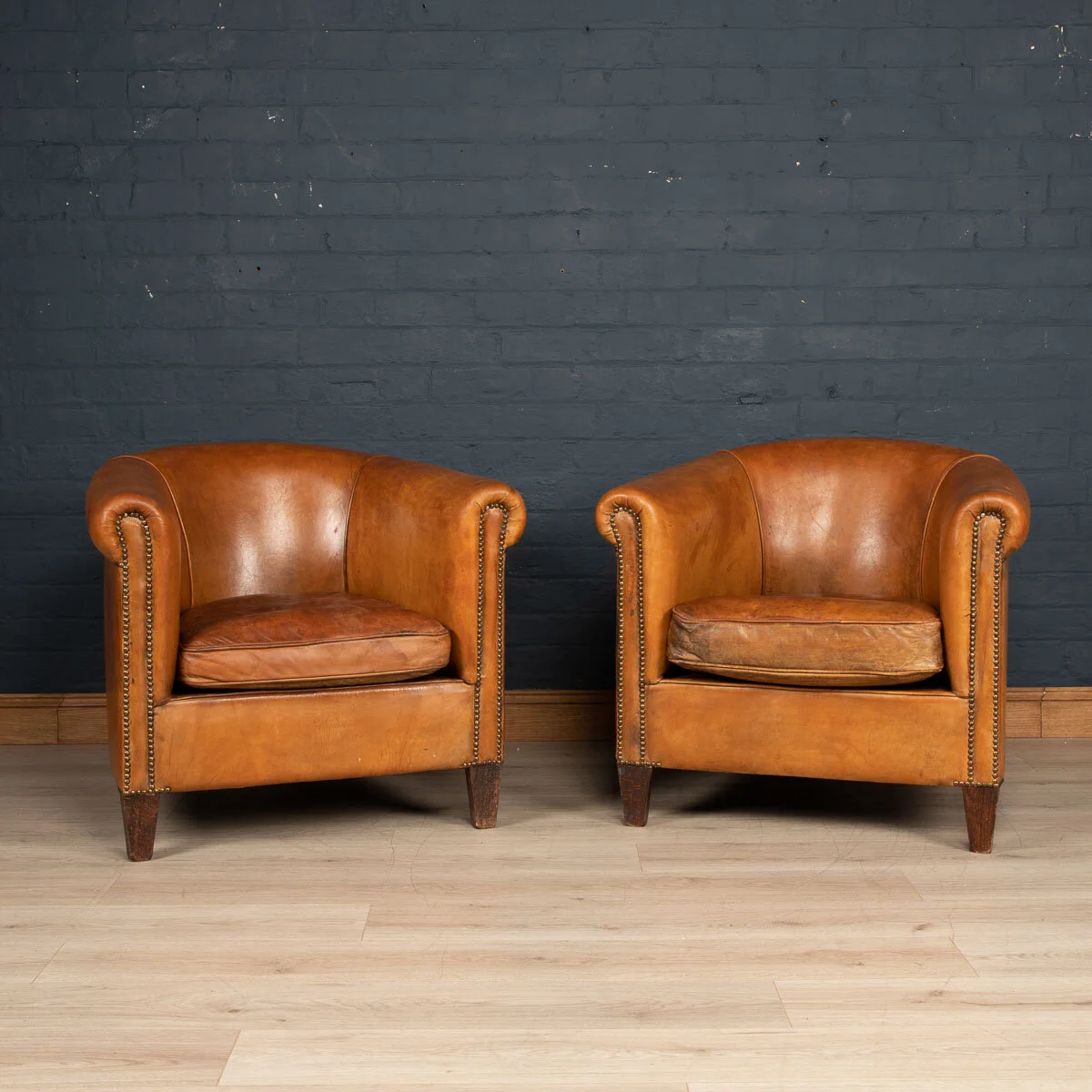 A pair of sheepskin leather tub chairs, Holland, late 20th century
