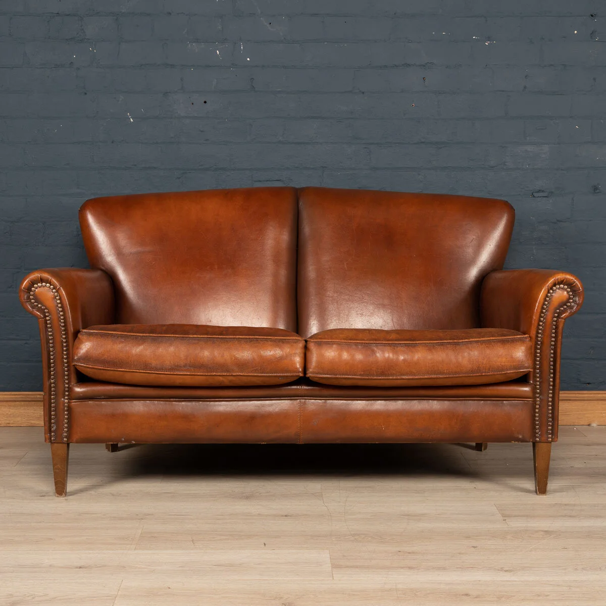 A two seater leather sofa, Holland, late 20th century