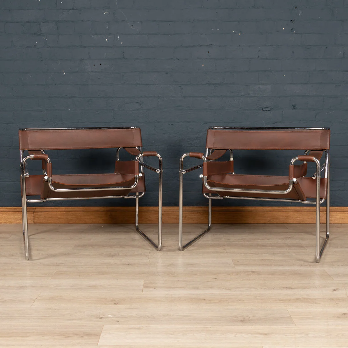 A pair of Wassily chairs, chrome plated and leather, circa 1980