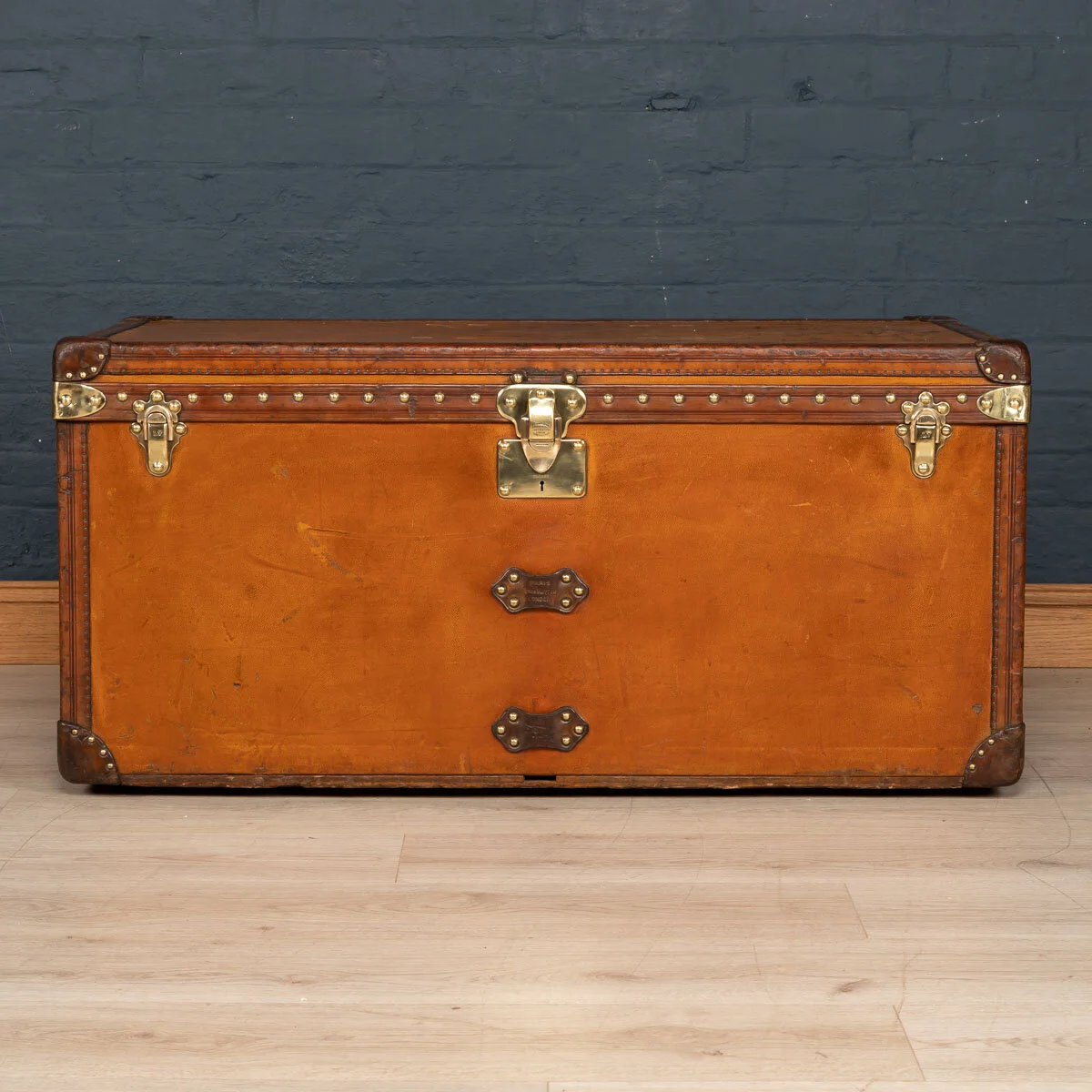 A Louis Vuitton courier trunk in orange Vuittonite canvas, France, circa 1905