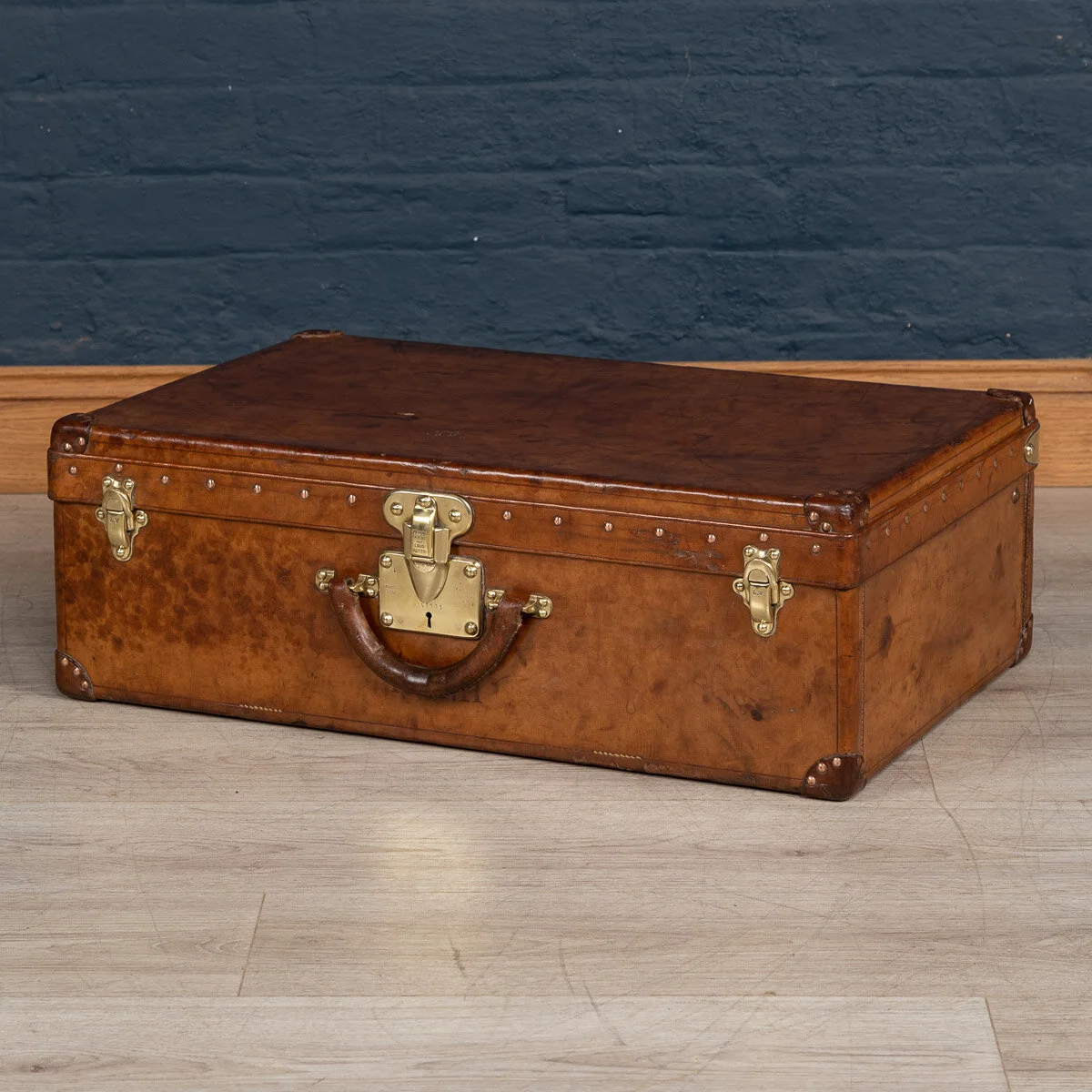 A Louis Vuitton suitcase in natural cow hide, France, circa 1900