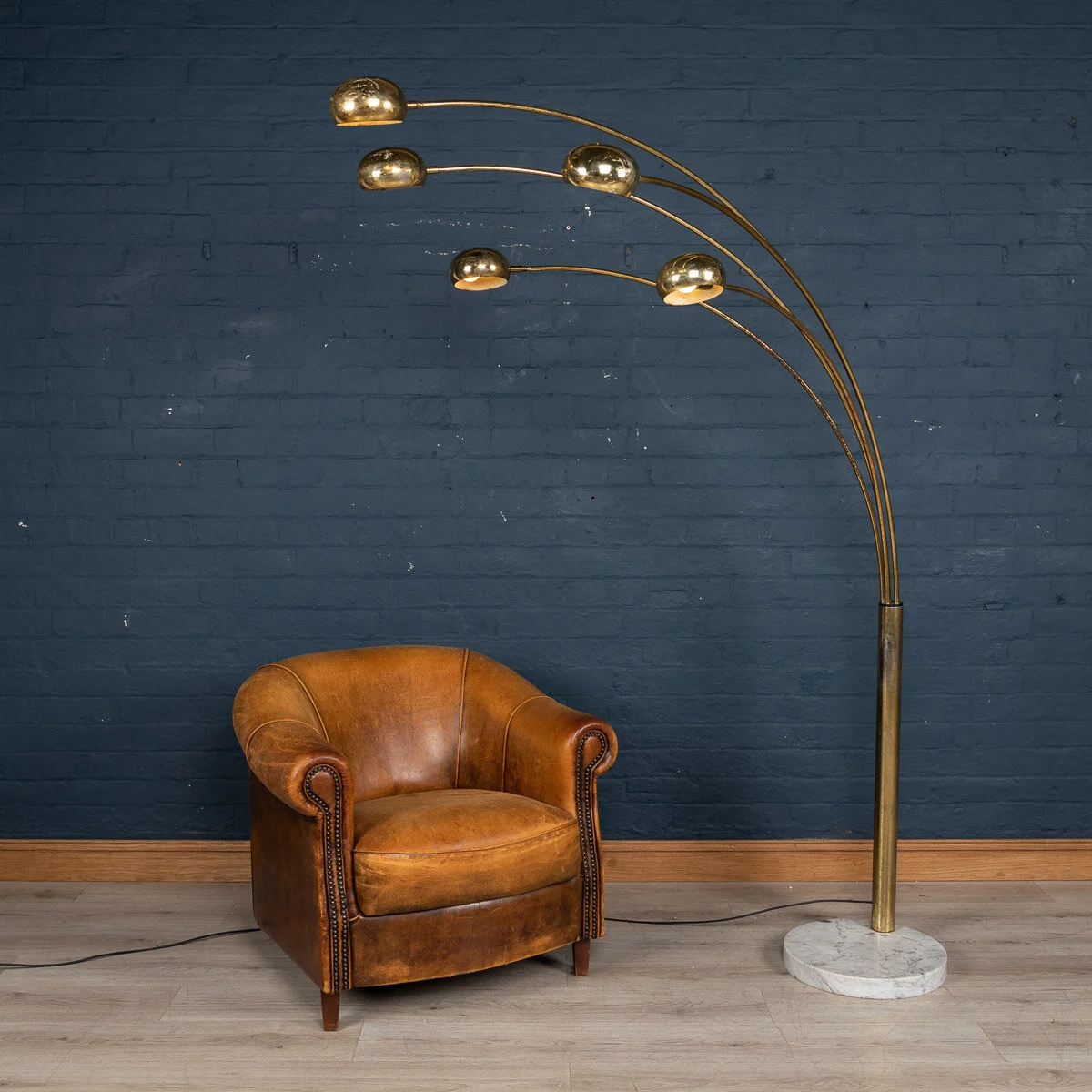 An arc floor lamp by Harvey Guzzini, Italy, circa 1970