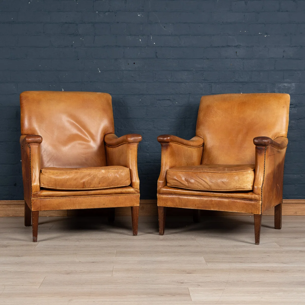 A pair of sheepskin leather club chairs, Holland, late 20th century