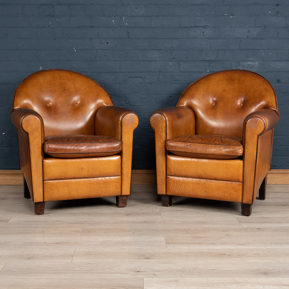 A pair of sheepskin leather club chairs, Holland, late 20th century