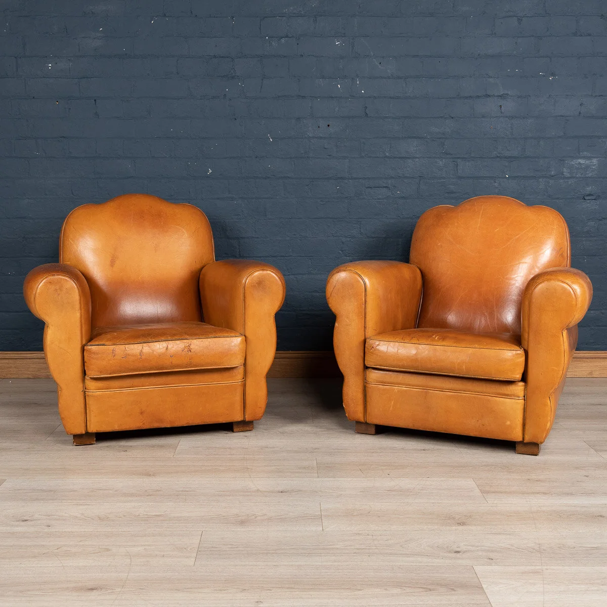 A pair of Art Deco style leather club chairs, France, late 20th century
