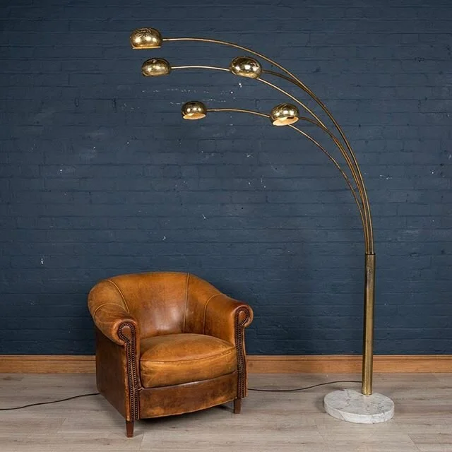 Chic Italian 1960s /1970s Harvy Guzzini arc floor lamp with five swivel arms and ball shades. Brass shades are adjustable, arms can be adjusted horizontally about 180 degrees. Supported by original thick marble base. Original wiring and in working co