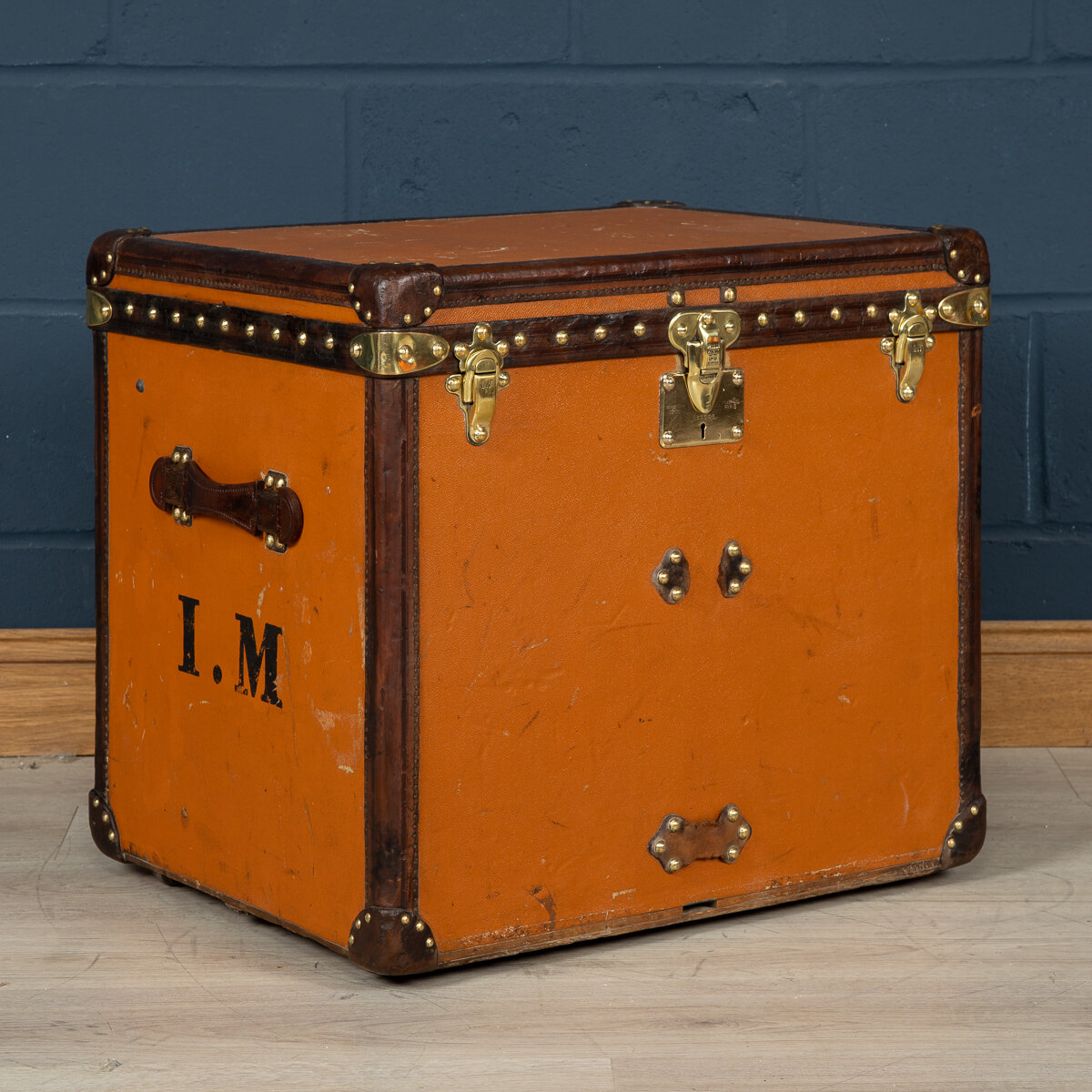 A Louis Vuitton hat trunk in orange "Vuittonite" canvas, France, circa 1905