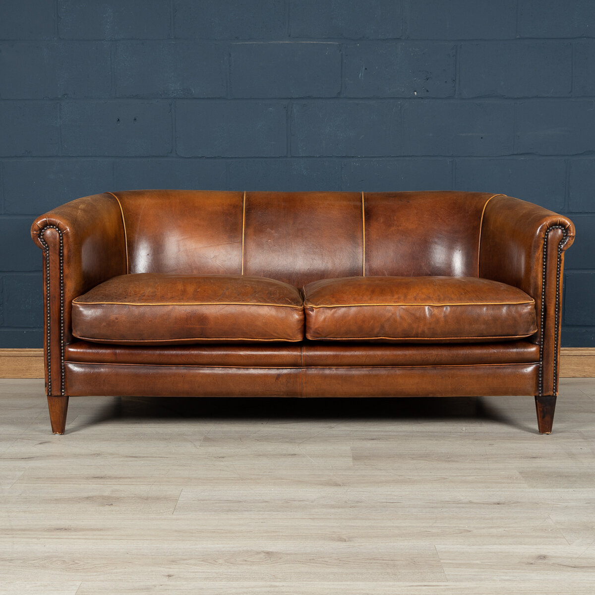 A two seater tan leather sofa, Holland, late 20th century