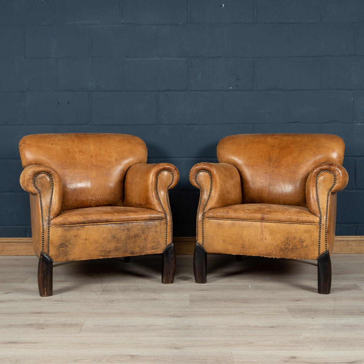 A pair of sheepskin leather club chairs, Holland, mid to late 20th century