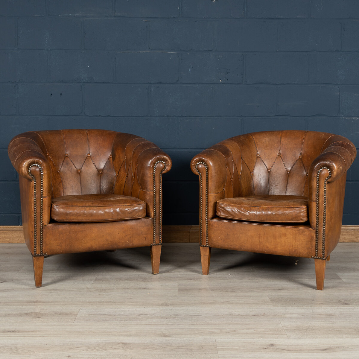 A pair of sheepskin leather tub chairs, Holland, late 20th century
