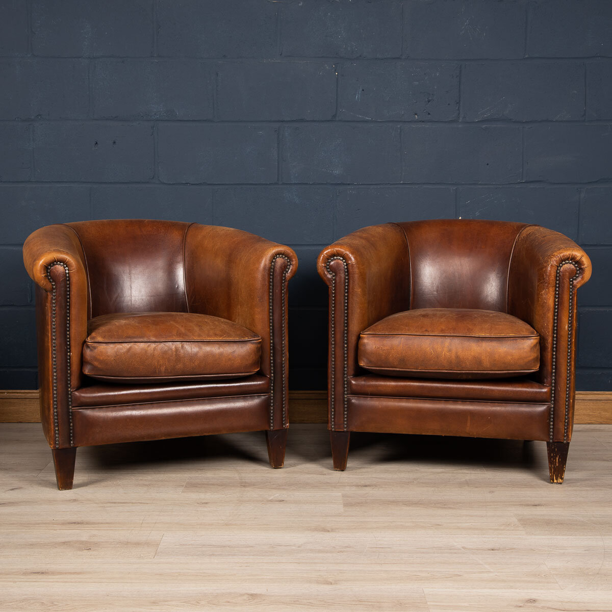 A pair of sheepskin leather tub chairs, Holland, late 20th century