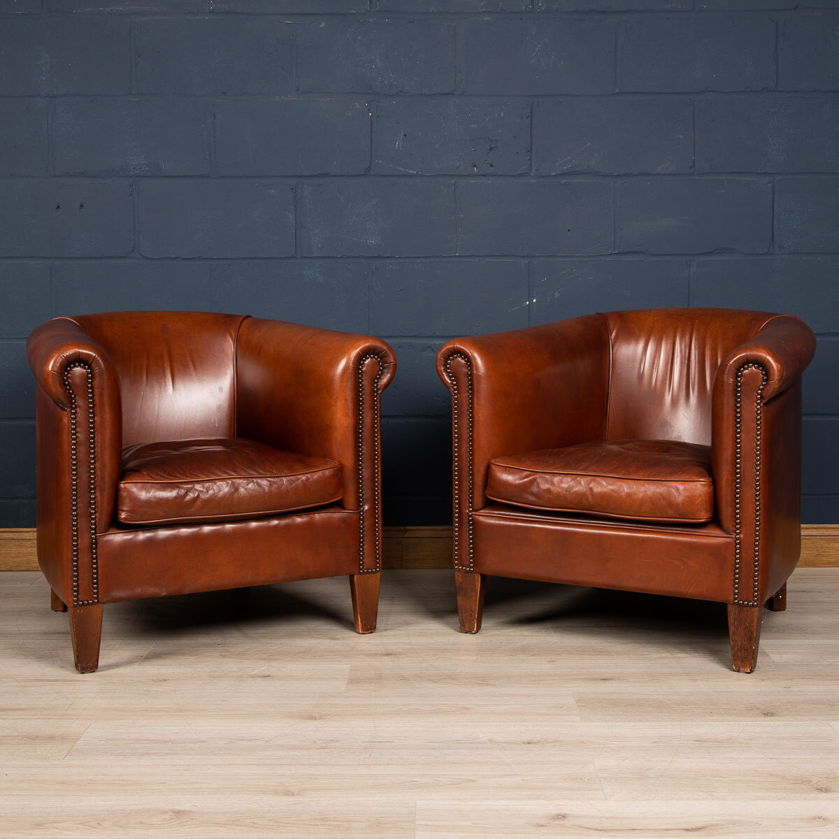 A pair of sheepskin leather tub chairs, Holland, late 20th century
