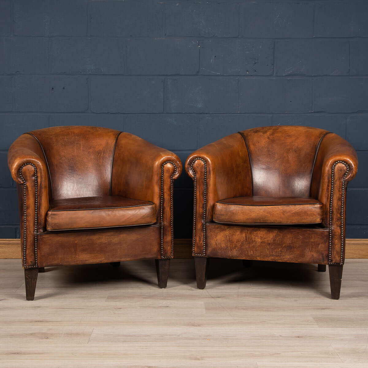 A pair of sheepskin leather tub chairs, Holland, late 20th century