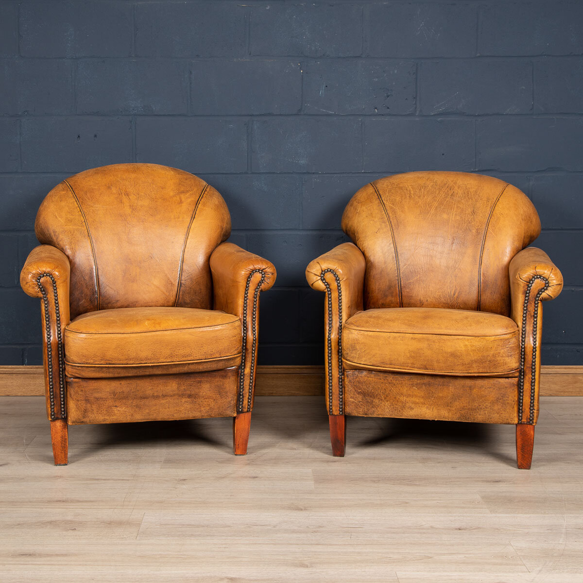 A pair of sheepskin leather club chairs, Holland, late 20th century