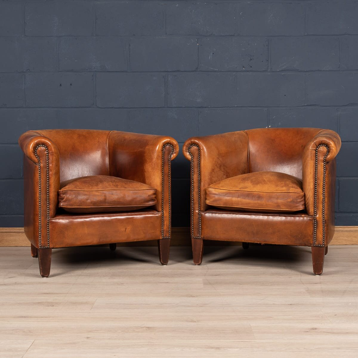 A pair of sheepskin leather tub chairs, Holland, late 20th century