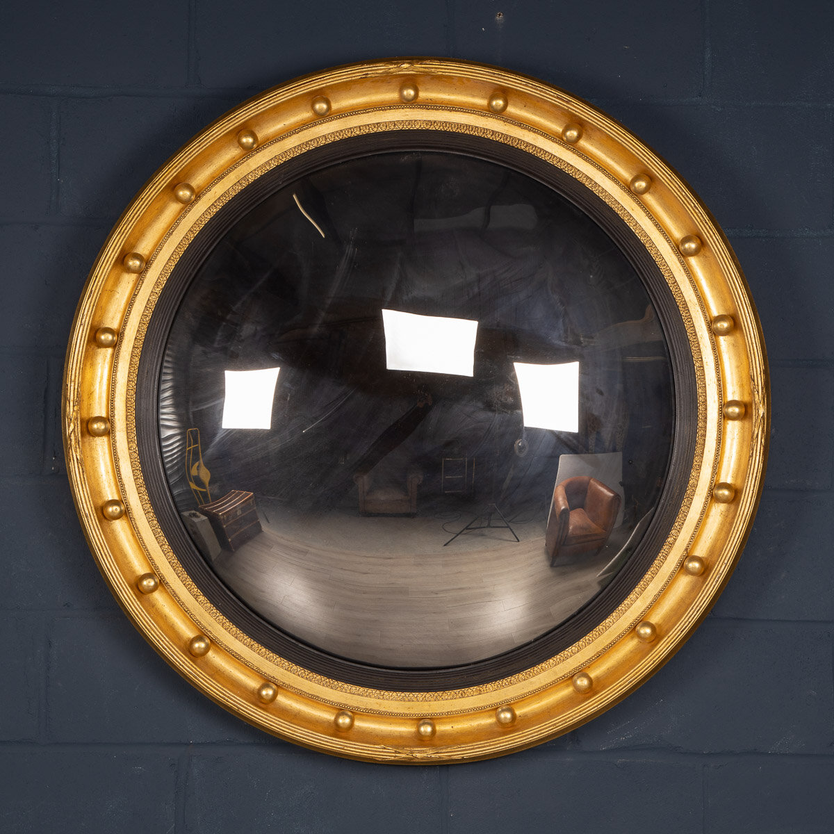 A massive convex mirror, England, late 20th century
