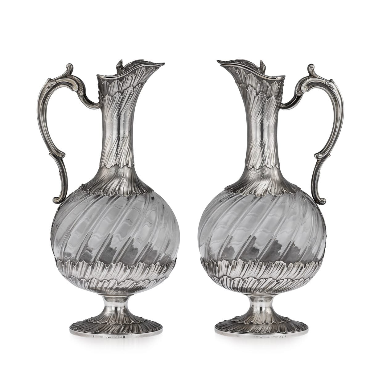 A pair of solid silver and glass claret jugs by Odiot, France, circa 1890