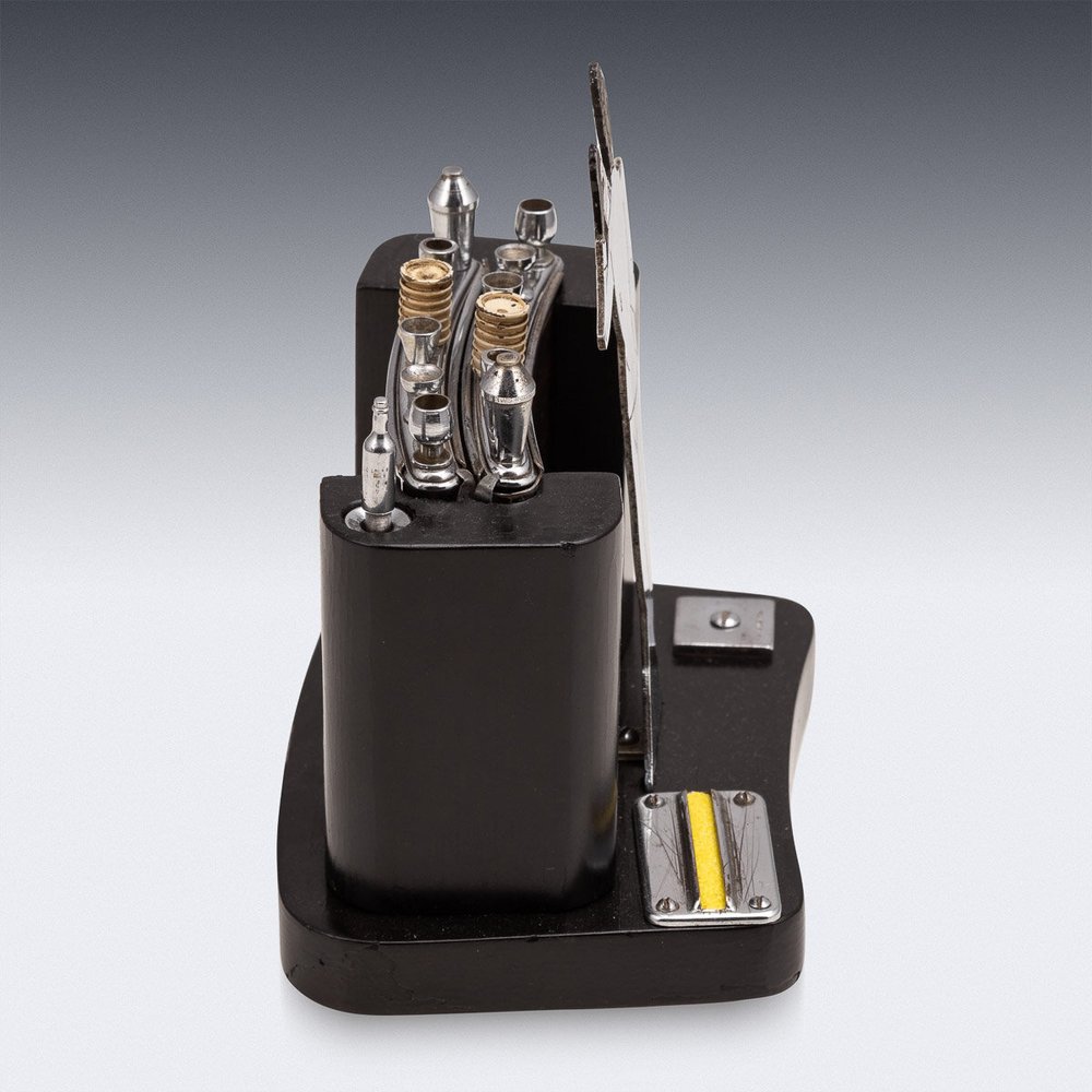 An antique 20th century Art Deco bar shaped cigarette dispenser, circa 1920  — Alessio Lorenzi