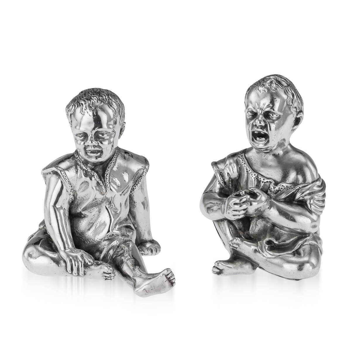 A Victorian solid silver figurative salt and pepper set, London, 1886