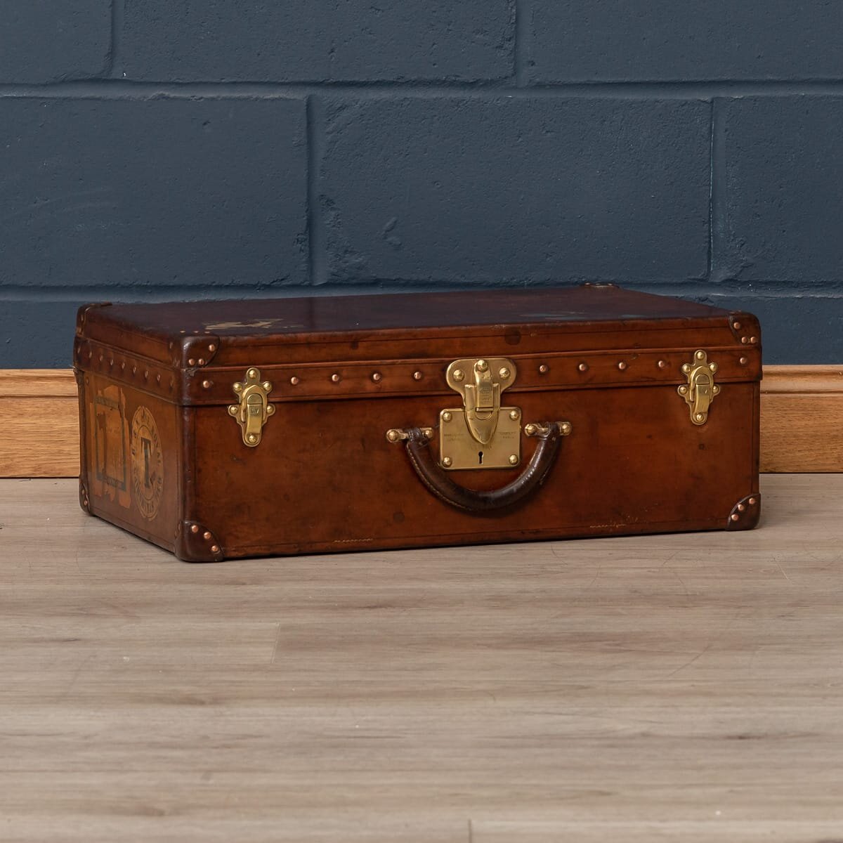 A Louis Vuitton suitcase in natural cow hide, circa 1900
