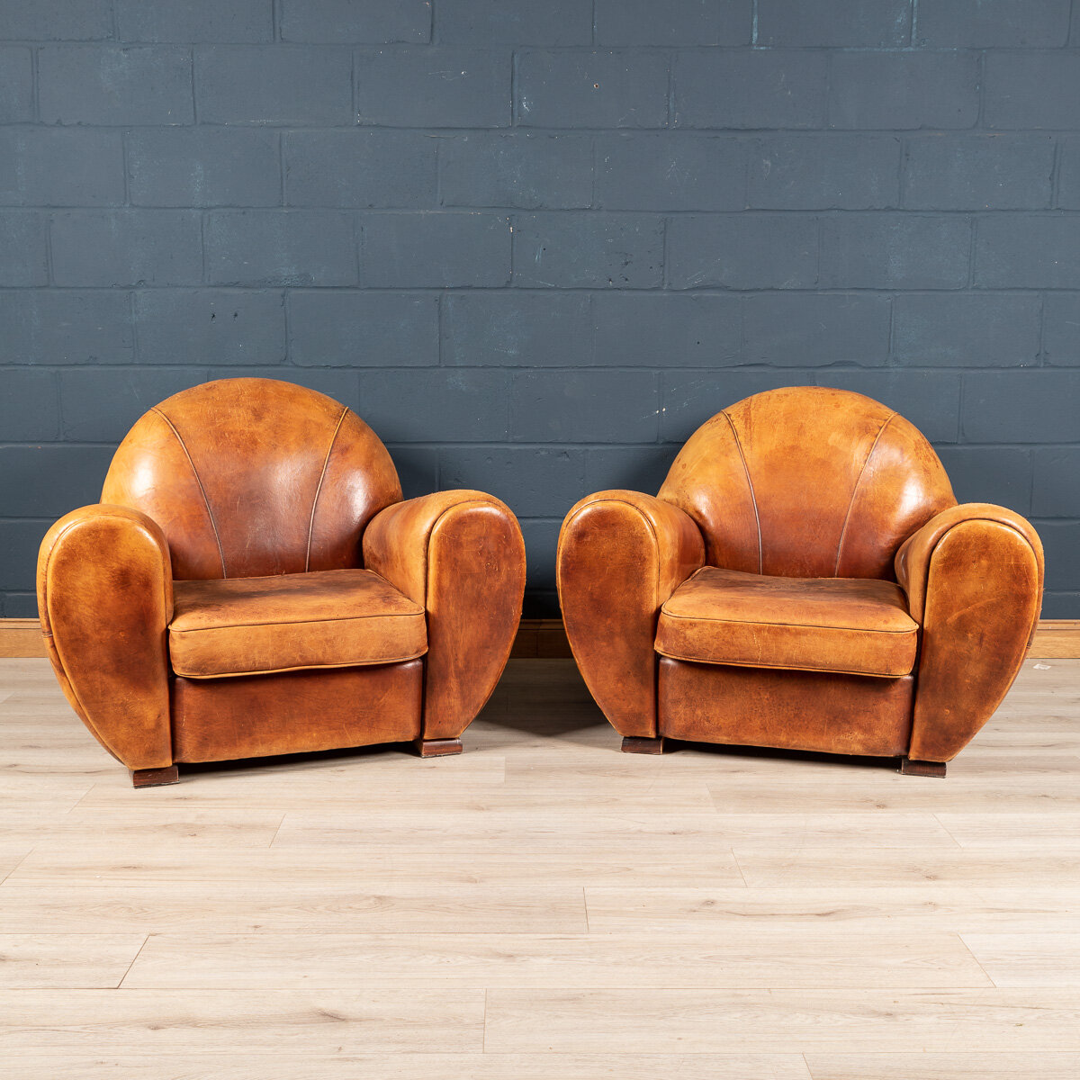 A pair of sheepskin leather club chairs, Holland, late 20th century