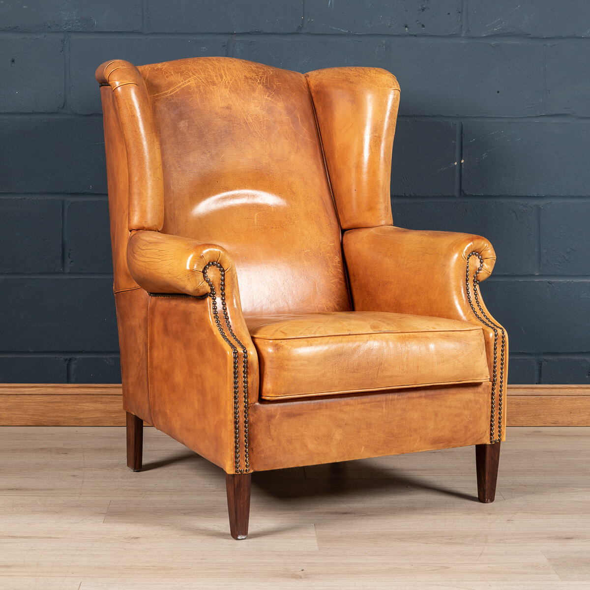 A sheepskin leather wing-back armchair, Holland, late 20th century