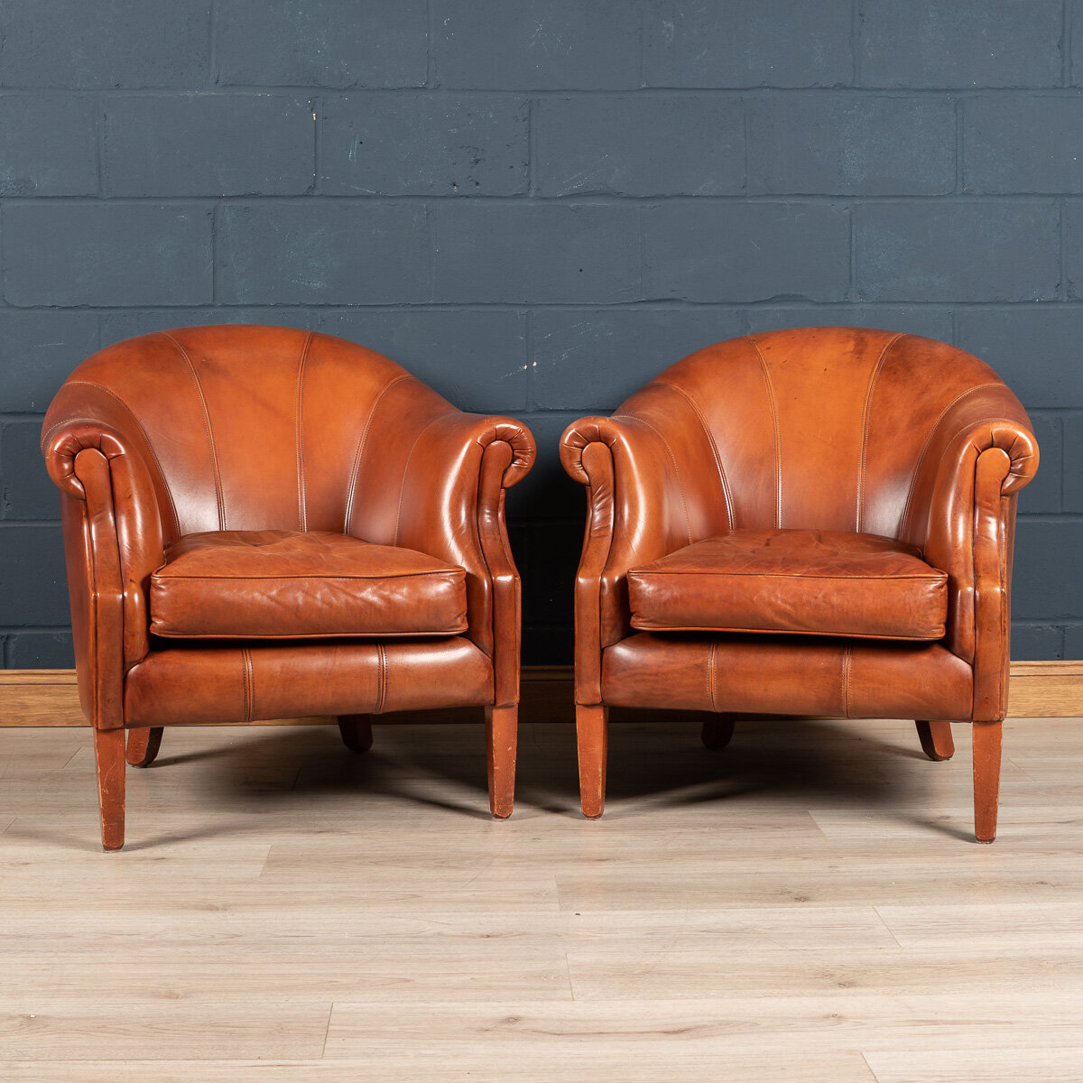 A pair of sheepskin leather club chairs, Holland, late 20th century