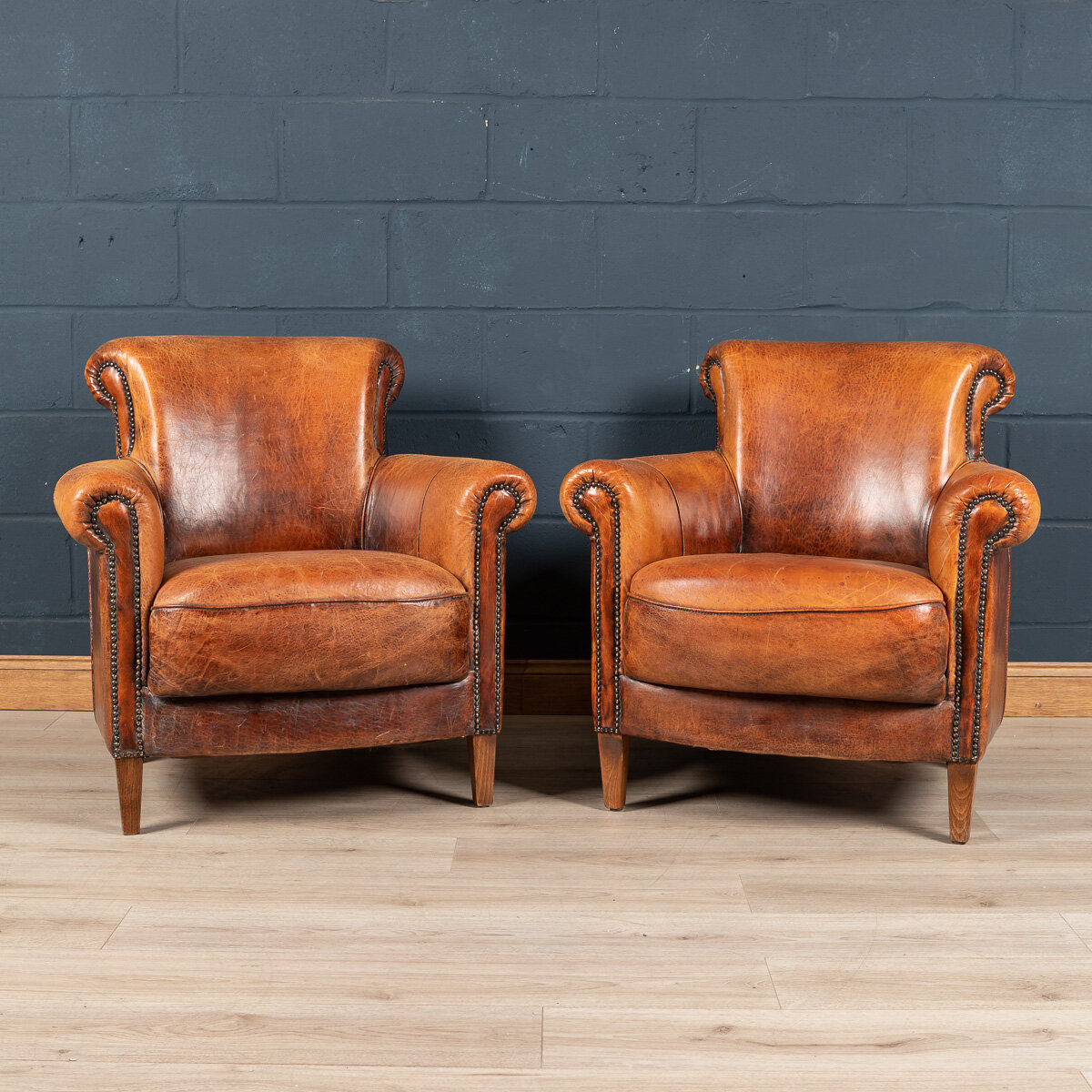 A pair of sheepskin leather club chairs, Holland, late 20th century