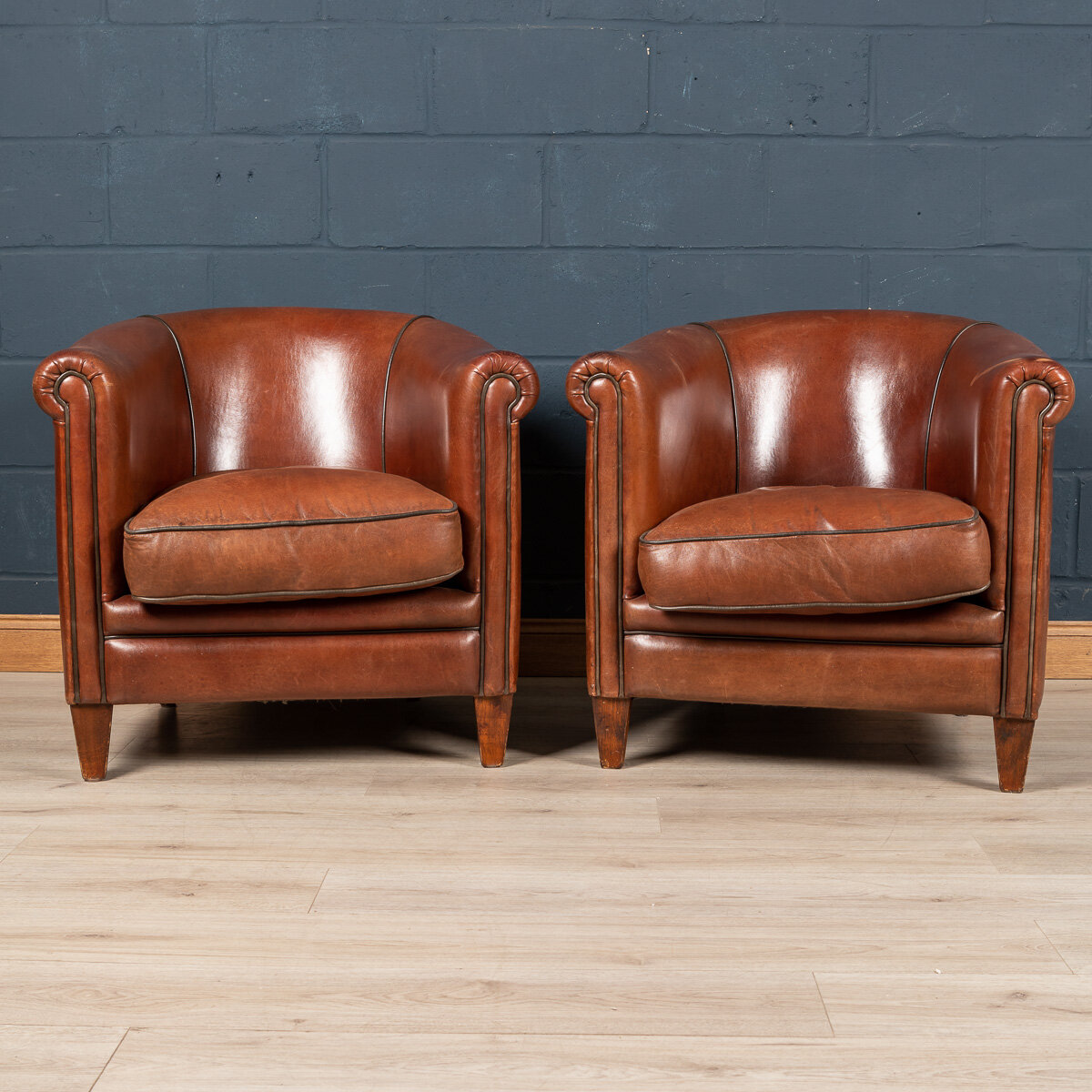 A pair of sheepskin leather club chairs, Holland, late 20th century