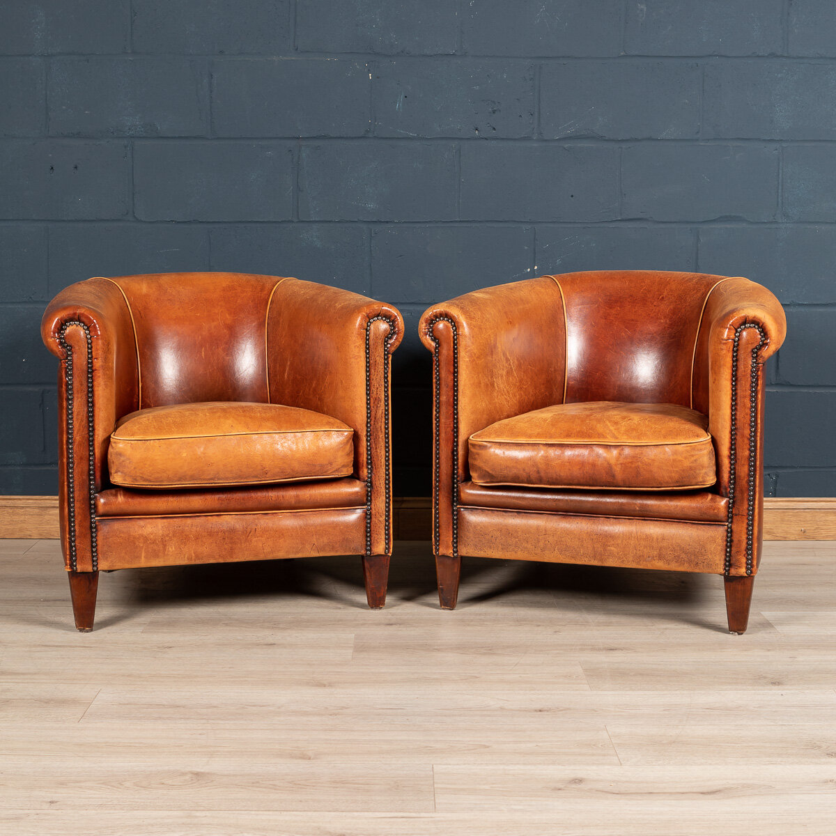 A pair of sheepskin leather club chairs, Holland, late 20th century