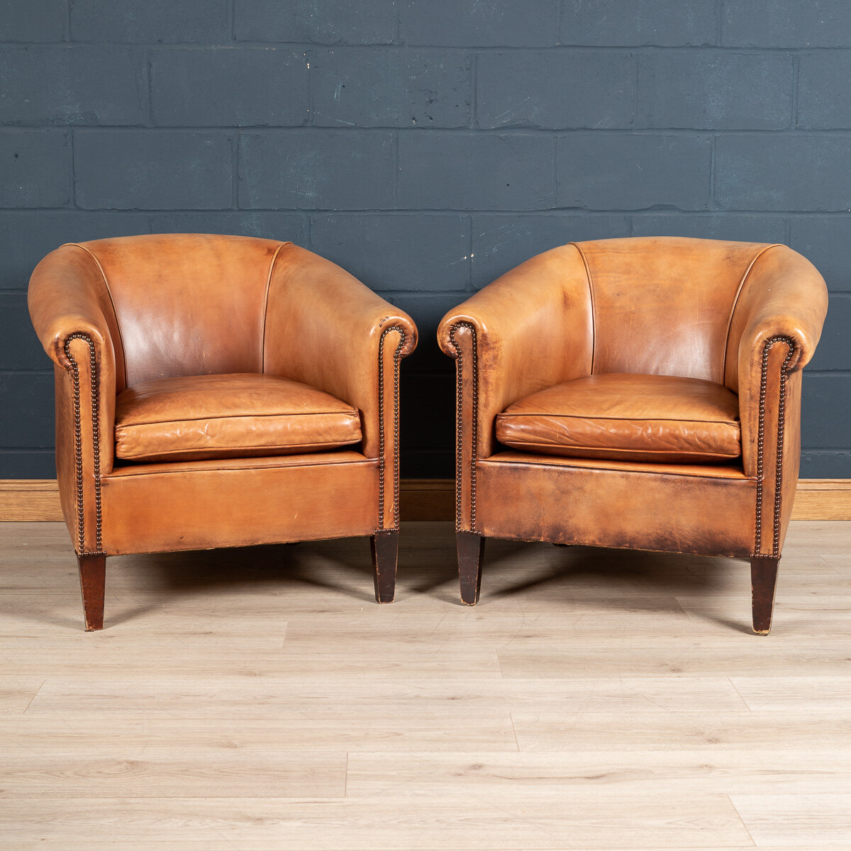 A pair of sheepskin leather club chairs, Holland, late 20th century