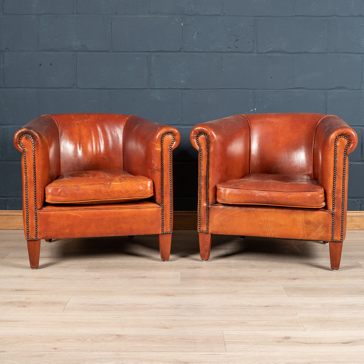 A pair of sheepskin leather tub chairs, Holland, late 20th century