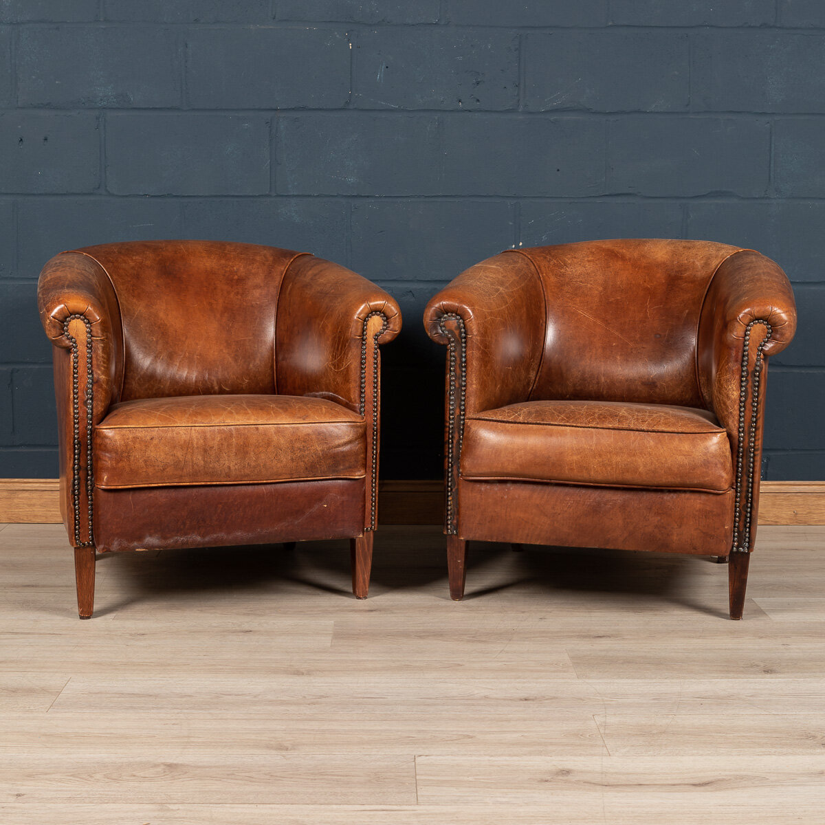 A pair of sheepskin leather club chairs, Holland, late 20th century