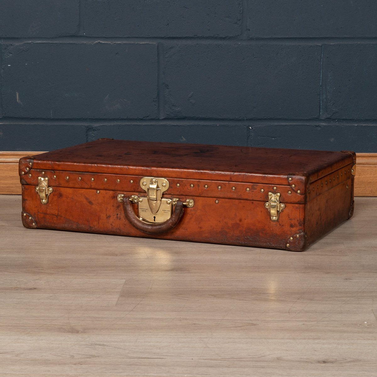 A Louis Vuitton suitcase in natural cow hide, France, circa 1900