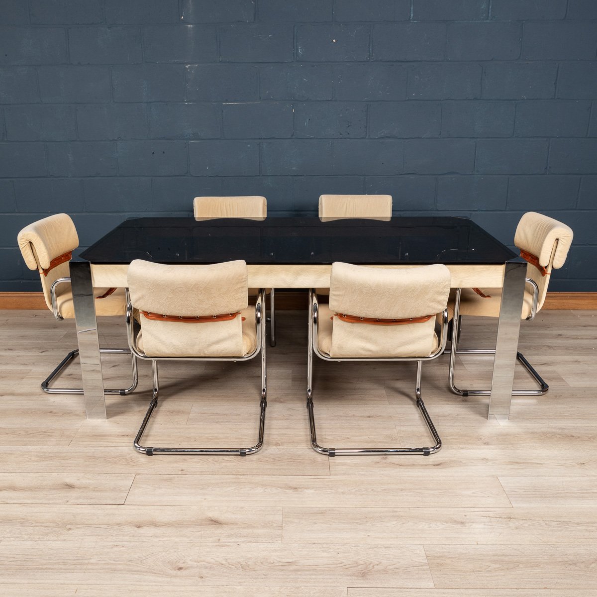 A dining table and six chairs by Guido Faleschini for Hermes, France, circa 1970
