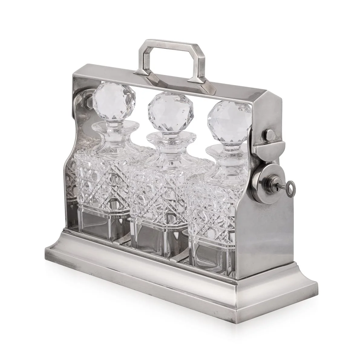 A silver-plated and cut crystal tantalus, England, circa 1930
