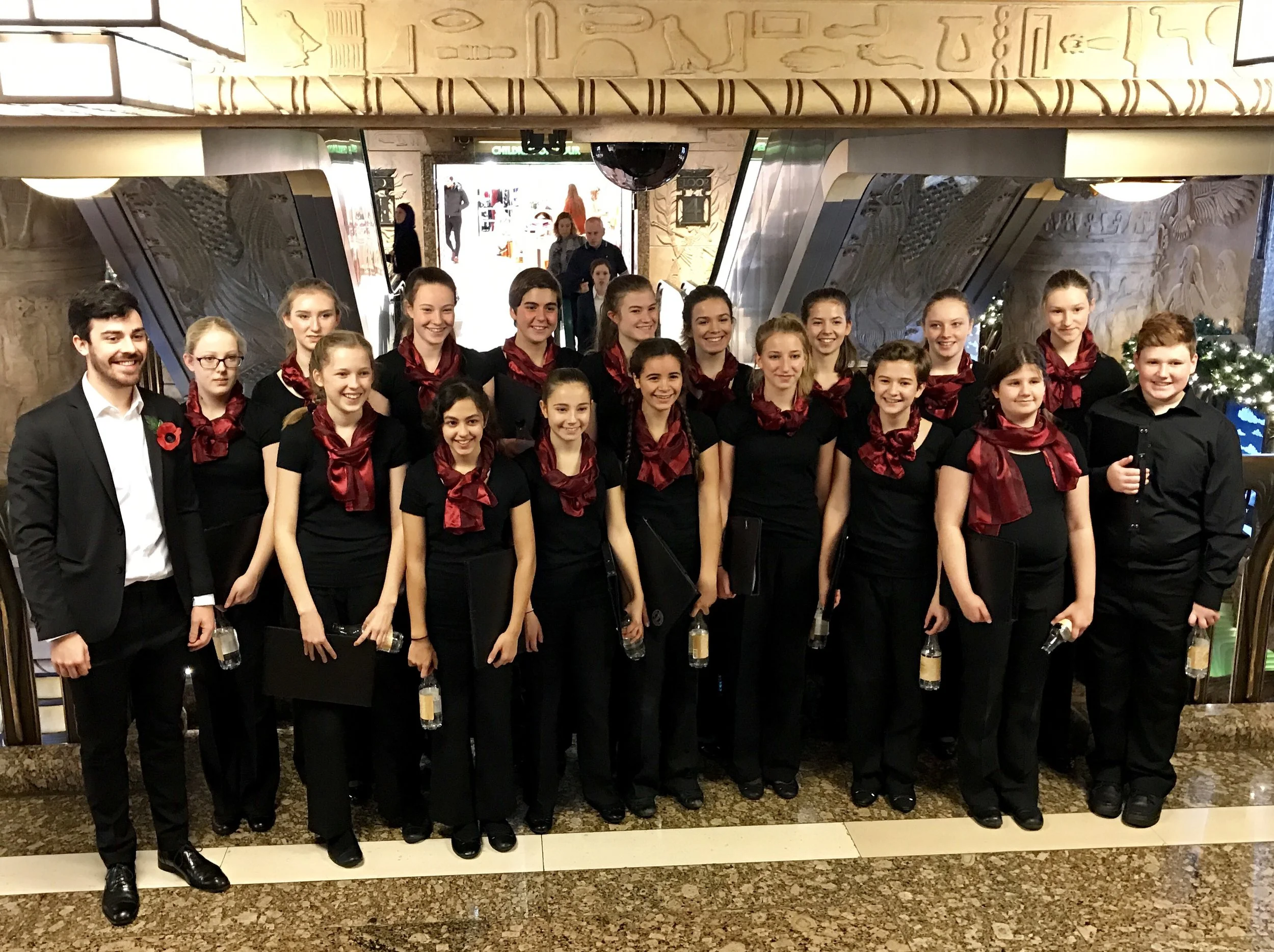 Patrick and the choir after singing carols between 4pm and 5pm at the Egyptian escalator in Harrods on 13th November.