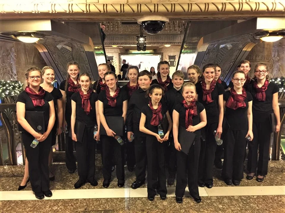 Jo and the choir after singing carols between 4pm and 5pm at the Egyptian escalator in Harrods on 20th November.