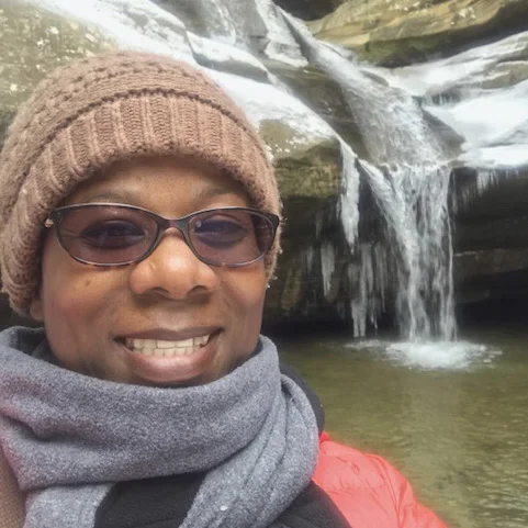 Kim Smith-Woodford is an advocate for diversity, equity and inclusion in the outdoors. She frequently creates and facilitates events and conversations that engage people of color to embrace nature’s presence while finding their joy. She’s grateful that her love of nature and nature equity has landed her opportunities to meet wonderful people across the country that share similar passions. She leads outdoor community groups and youth hikes. She participates in community thought leader discussions and speaks on nature equity panels as well as to groups surrounding DEI in the outdoors and environmental stewardship. Through her consulting business, Journey On Yonder, her goal is to advance the narrative of diversity in the outdoors. Kim’s journey has taken her to some of the most amazing spots within the country including the Grand Canyon, Yosemite and Yellowstone National Parks. But you can often catch her trekking around in our local parks, hugging trees while taking a bazillion nature photos and selfies and most of all, creating black JOY in nature. She enjoys life with her husband Kelvin and her three puppies, Zoe, Max and Tux.