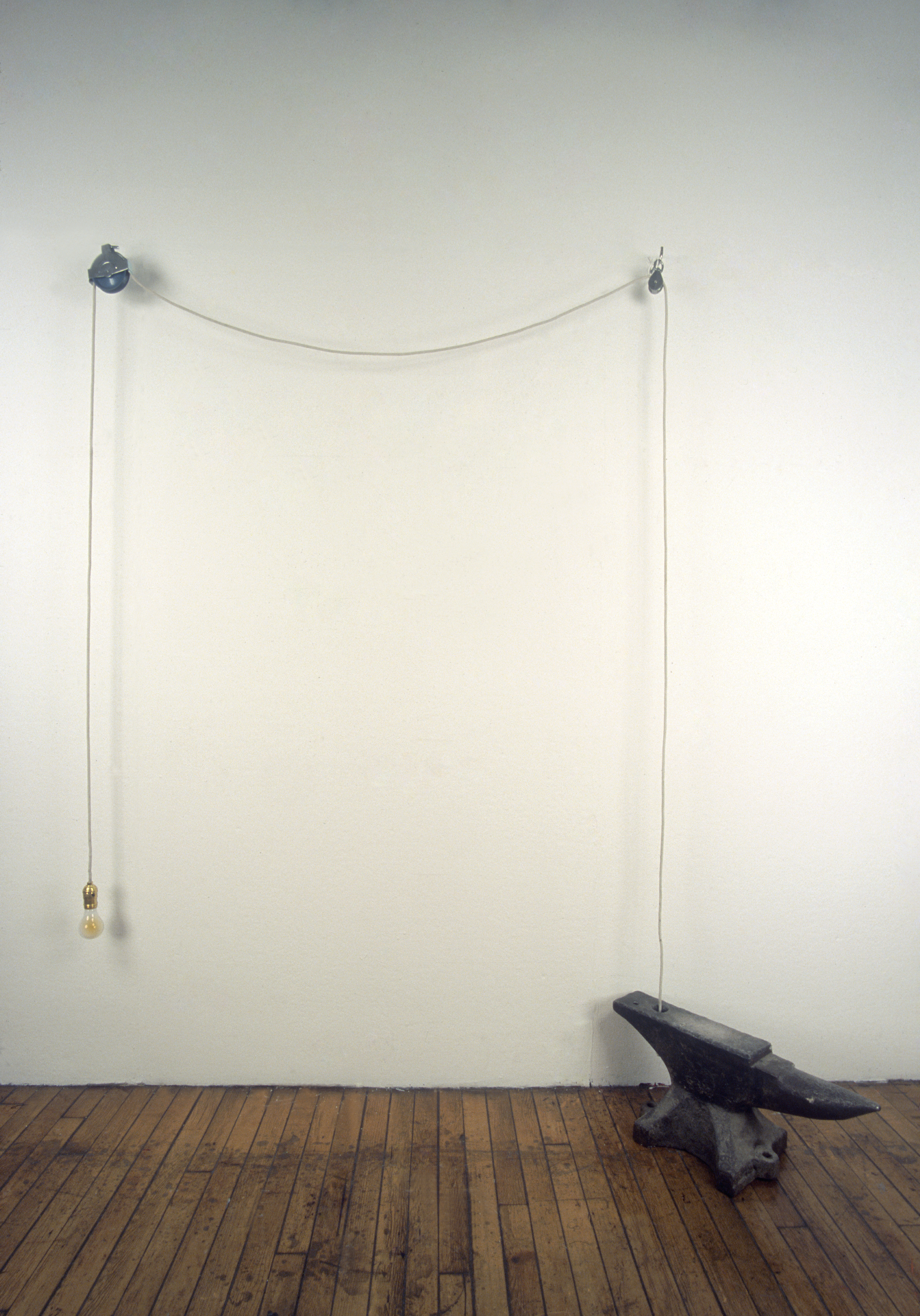 “It's Lightweight” Light bulb, rope, pulleys, hooks and anvil Dimensions variable 2001