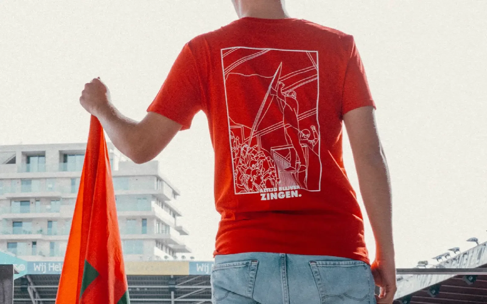 Football supporter T-shirt design by Nope Design, featuring bold illustration for sports fan merchandise.