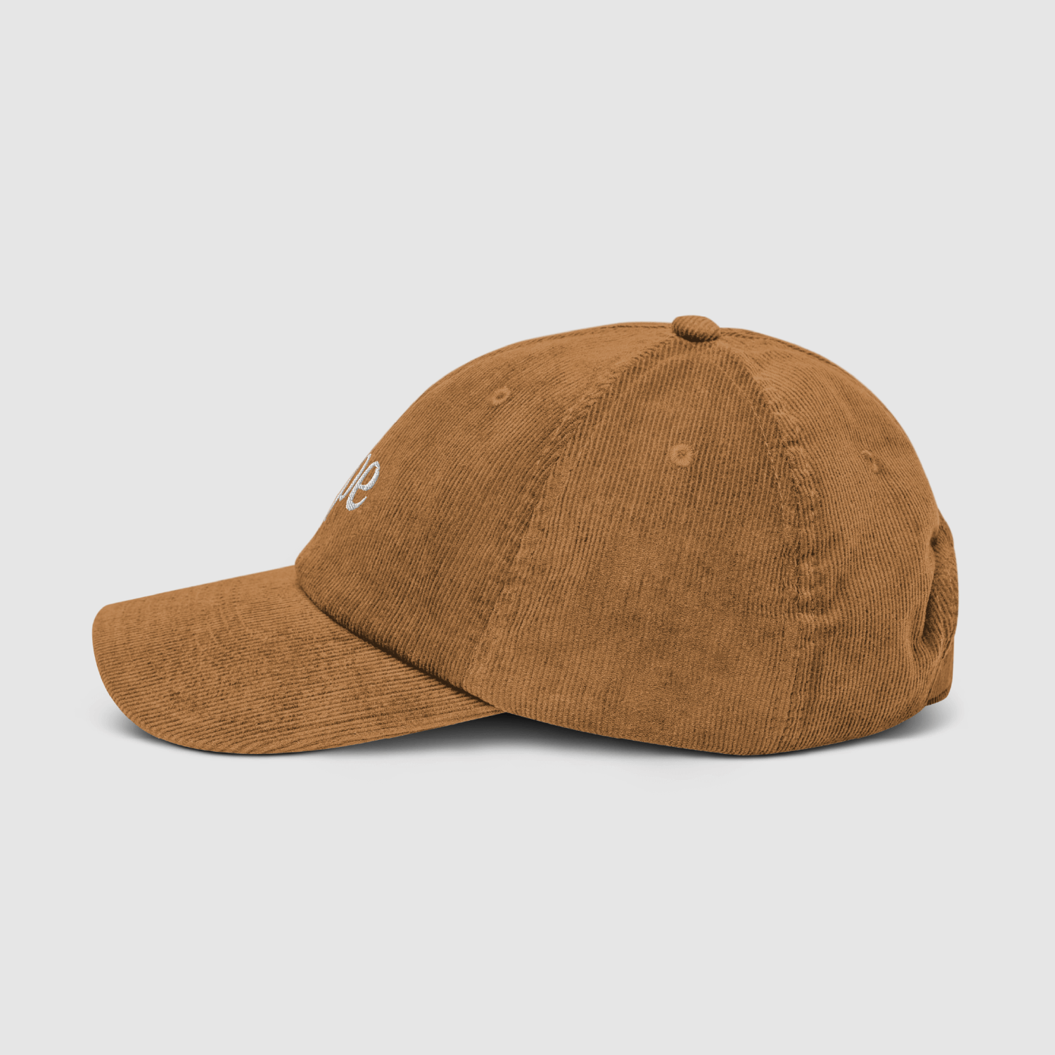Side profile of the camel dad cap with visible corduroy detail and embroidery