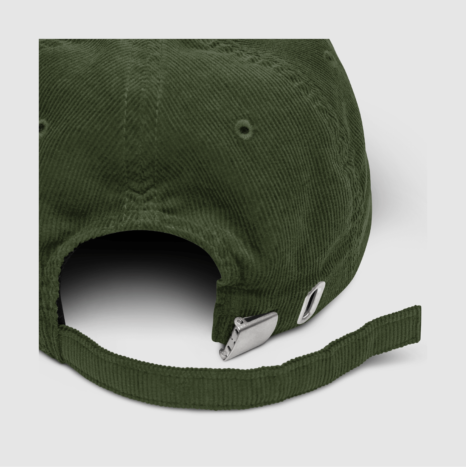 Close-up of strap and buckle hardware on the olive corduroy Nope Cap