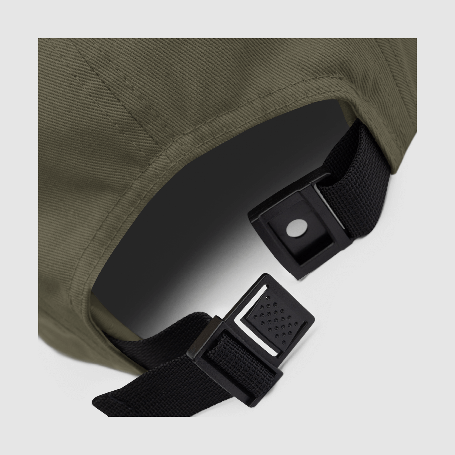 Close-up of adjustable nylon strap clip on 5 panel cap