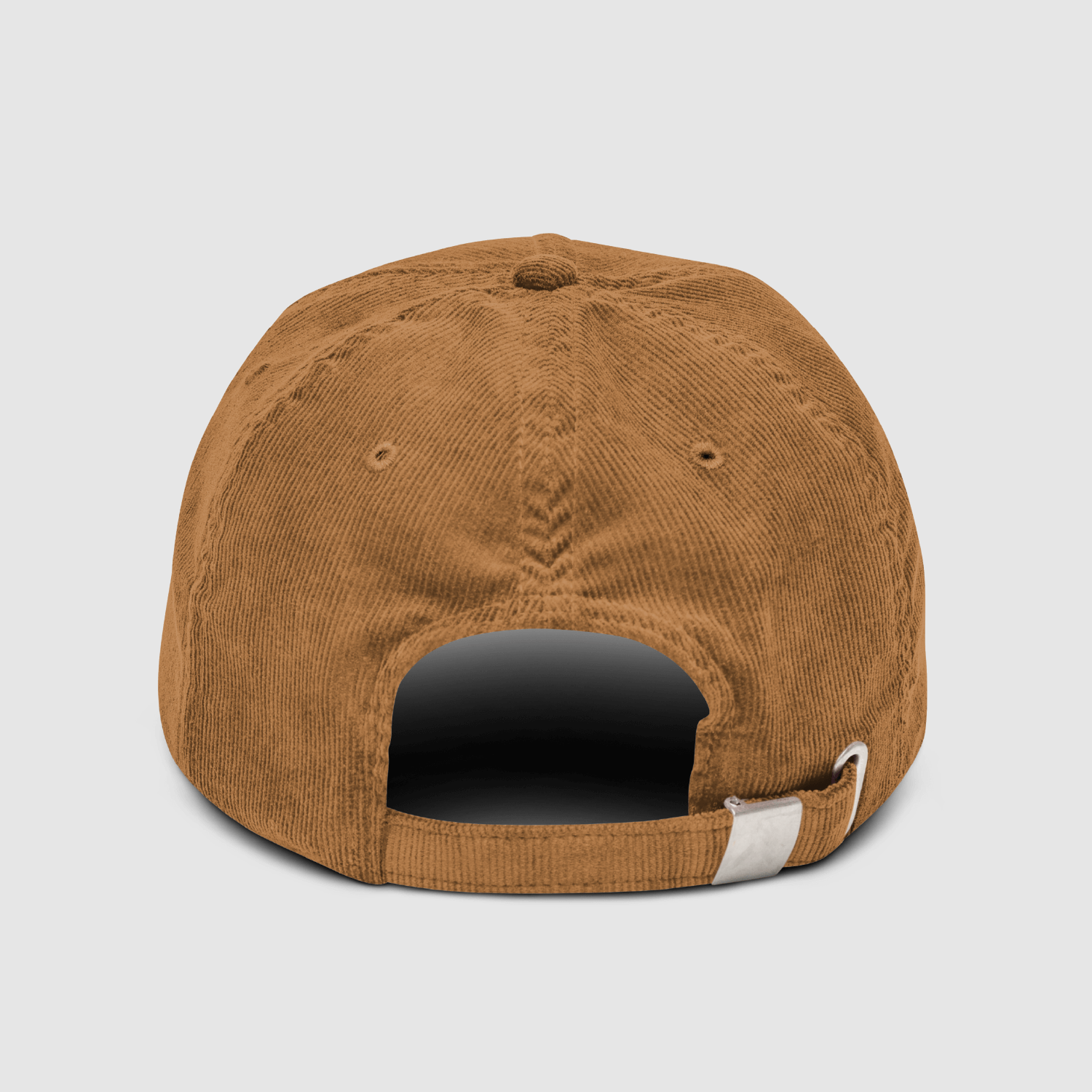 Rear view of the Nope Cord Cap featuring metal buckle strap in matching camel fabric