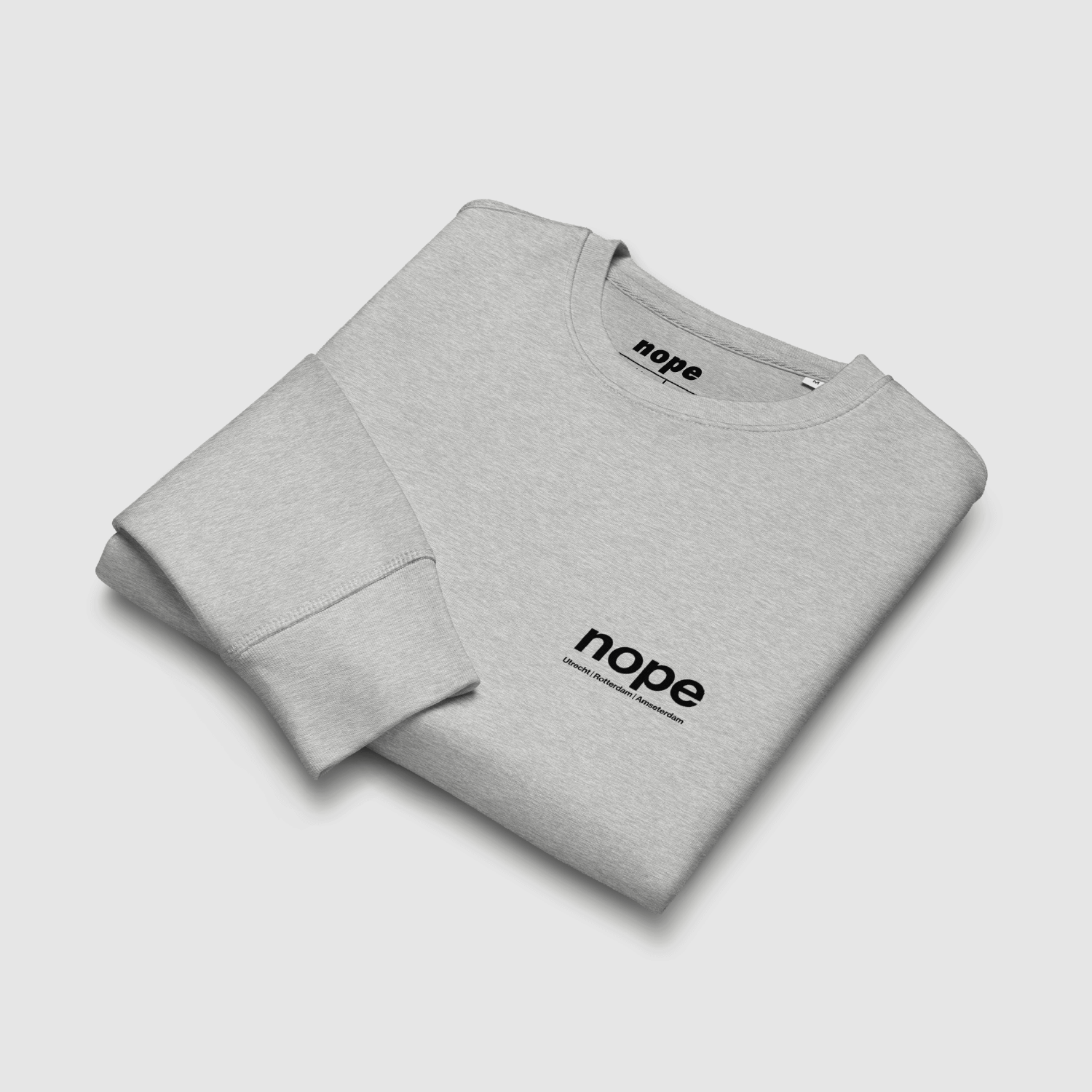 Folded View: Folded Nopehaus sweatshirt in heather grey showing chest print – designed by Mr. Nope