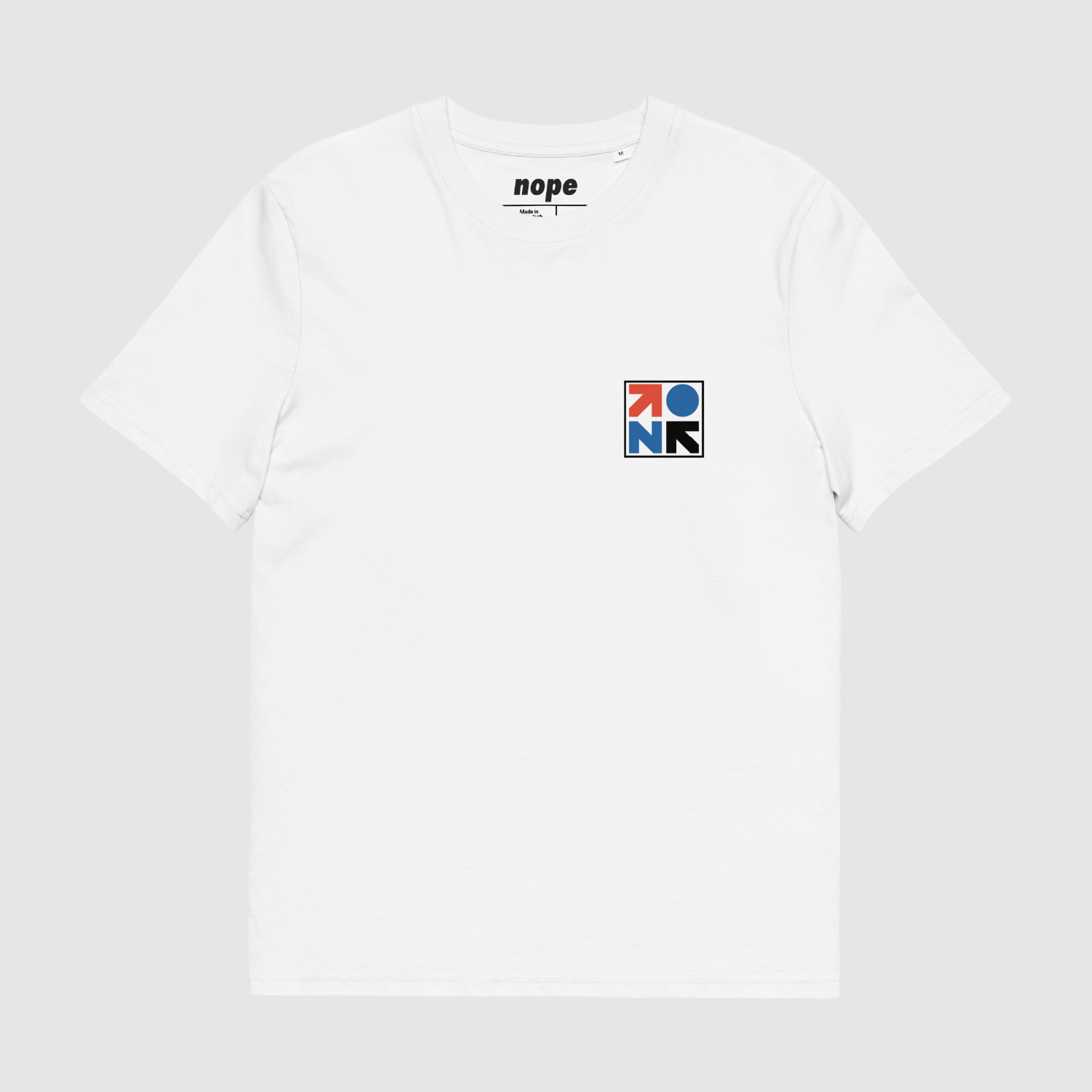 Front of white NOPEHAUS Primary T-Shirt with minimalist modular graphic by Mr. Nope