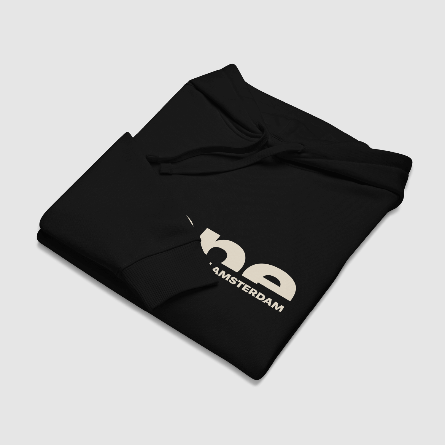 Folded black hoodie showing nope text logo across chest – clean and graphic apparel by Mr. Nope
