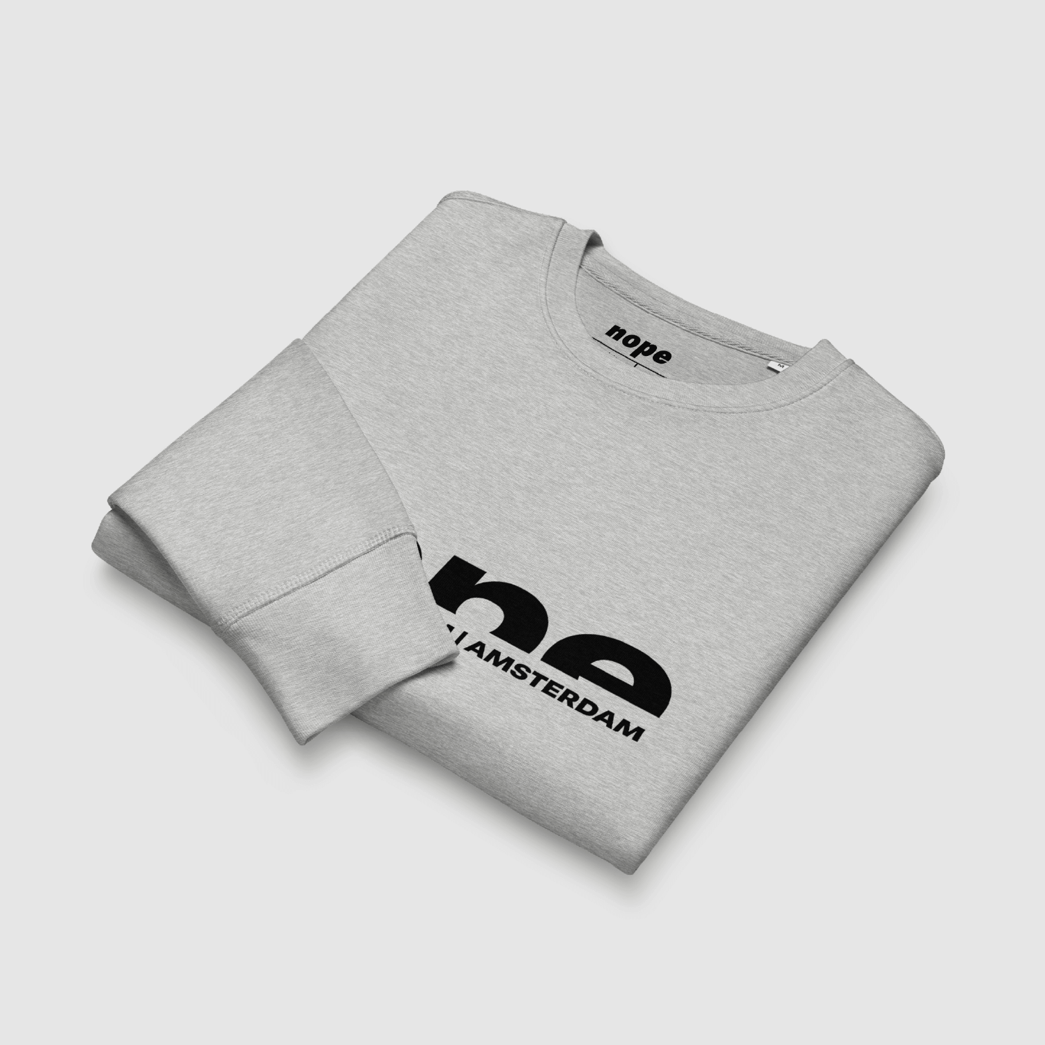 Folded Nope Text Logo Sweatshirt in grey showing front chest print with city name graphic – eco-friendly streetwear by Mr. Nope